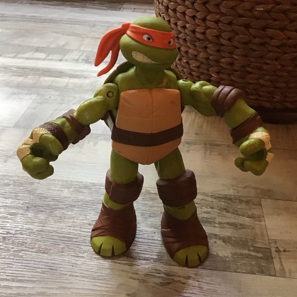 Michelangelo action figure toy from 2012 Teenage Mutant Ninja Turtles series